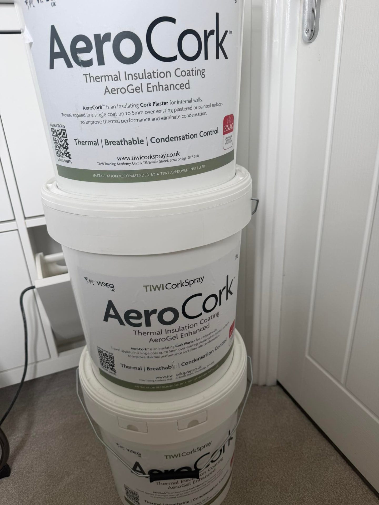 Tubs of AeroCork insulation material on site before application